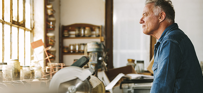 Man looking out of kitchen window